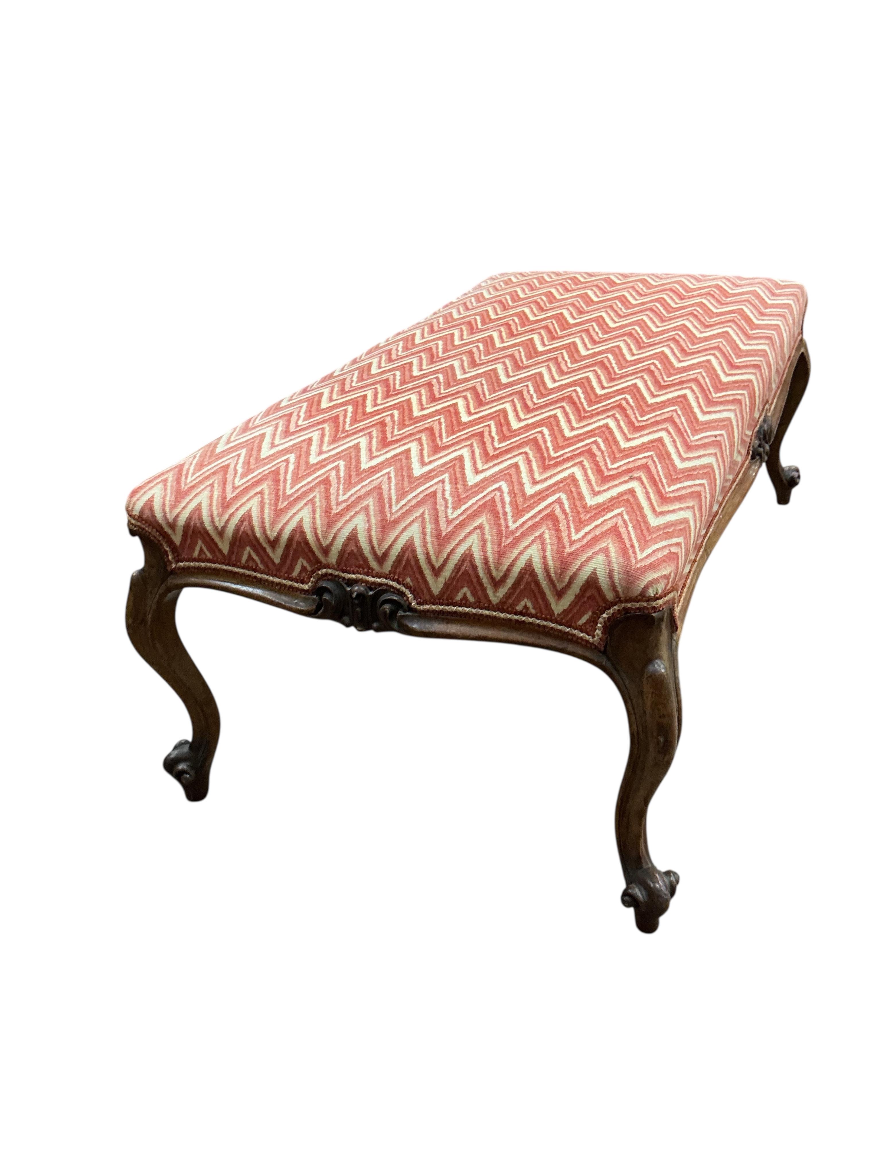A Victorian walnut dressing stool, width 106cm, depth 55cm, height 40cm